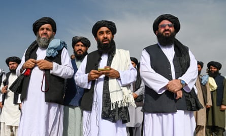 Taliban spokesman Zabihullah Mujahid speaks to the media at the airport in Kabul on 31 August after the US had pulled all its troops out of the country