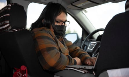 High school student Evan Allen attends online classes in his grandmother’s truck, parked on a remote hill on the Navajo Nation. He sat alone in the truck all year in order to get a decent internet connection.
