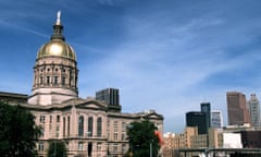 CAPITOL<br>FOR USE WITH “TRAVEL ATLANTA”--The Georgia State Capitol, guilded in gold from Dahlonega, Ga., is shown with the Atlanta skyline at right in downtown Atlanta March 2, 1999. (AP Photo/Ric Feld)