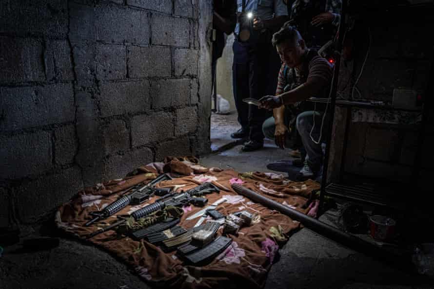 Large-calibre assault weapons confiscated during a search of a safe house in Zone 12 of Guatemala City controlled by the Mara Salvatrucha.