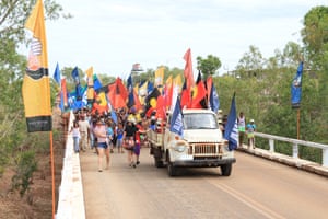 A march to commemorate the 50th anniversary of the Wave Hill walk-off crosses a bridge over the Victoria River at Kalkarindji in the Northern Territory.