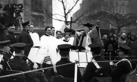 Dame Ethel Smyth conducts the Police Band in 1930 during the ceremony to unveil the Pankhurst Statue in Victoria Tower Gardens, London