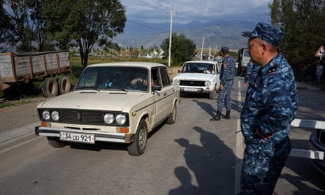 Refugees cross the border from Nagorno Karabakh into Armenia through the Lachin corridor.