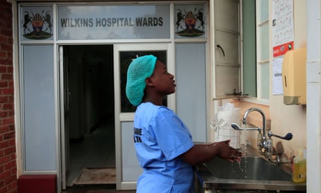 A health worker washes her hands during a demonstration of preparations for any potential coronavirus cases at a hospital in Harare, Zimbabwe, March 11, 2020.