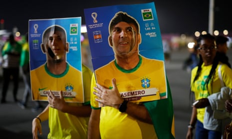 Brazil fans strike a pose outside Stadium 974.