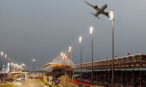 A plane flies over the track before the Bahrain Grand Prix
