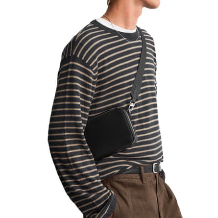 Zara cross body bag worn by male model.