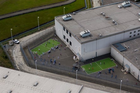 Detainees exercise in an outdoor recreation area at the Northwest ICE Processing Center.