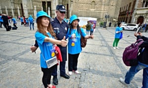 Tiens workers pose for photos.