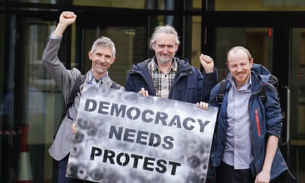 Roger Hallam, centre, pictured with Dr Larch Maxey and Mike Lynch-White outside Isleworth crown court in London in April.