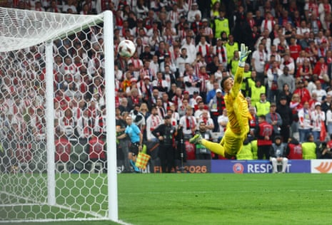 Aston Villa’s Emiliano Buendia scores their second goal past SC Freiburg’s Noah Atubolu