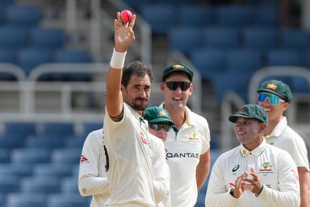 Mitchell Starc holds up the pink ball after dismissing West Indies' Mikyle Louis for his 400th Test wicket at Sabina Park in Kingston. in July.