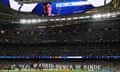 The big screen show an image of Real Madrid's Vinicius Junior inside the stadium before the match against Bayern Munich.