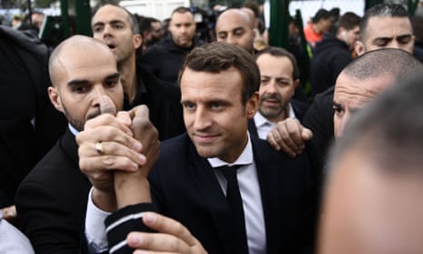 Emmanuel Macron meets with youth during a campaign visit to Sarcelles, north of Paris, on Thursday.