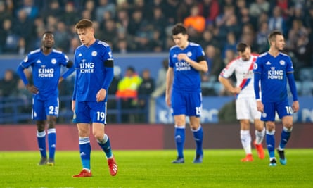 Leicester City players look dejected after conceding their fourth goal in stoppage time.