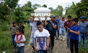 A boy carries a photo of Jakelin Caal, who died two days after being taken into custody by US border patrol agents. 4512.jpg?width=300&quality=85&auto=forma