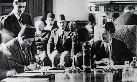 Muṣṭafā al-Naḥḥās Pasha signing the Anglo-Egyptian treaty, 1936, in front of Anthony Eden.