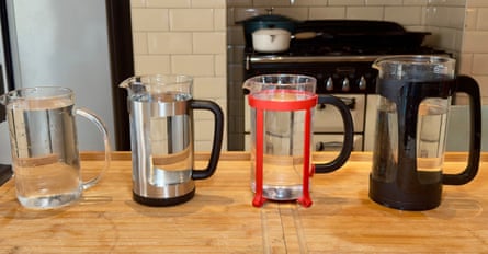 Four cafetieres on a wooden kitchen worktop