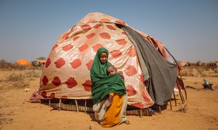 A mother and her child seek shelter at the Doolow refugee camp after fleeing drought in territory occupied by al-Shabaab.