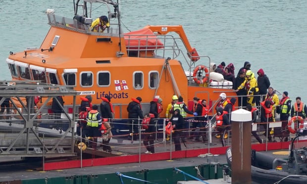 A group of people thought to be migrants are brought into Dover, Kent, on an RNLI boat.