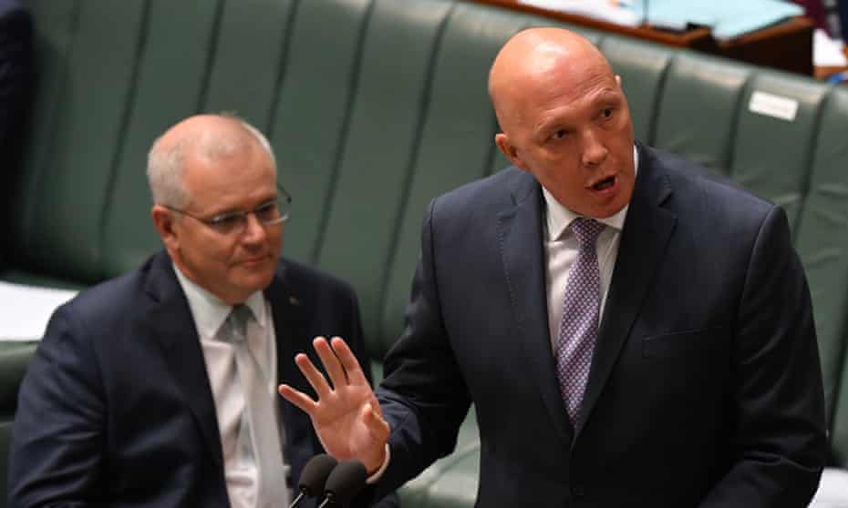 Australian prime minister Scott Morrison watches on as Peter Dutton speaks in parliament