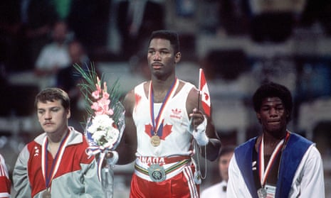 Lennox Lewis and Riddick Bowe stand on the podium at the 1988 Olympics.