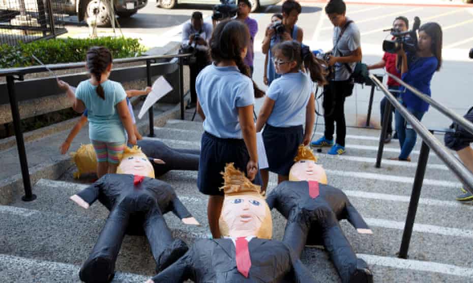US-born children of immigrants drag Donald Trump pinatas down stairs. This week, a top Republican senator has joined forces with a Democrat senator to urge President Trump to grant legal status and a path to citizenship to undocumented immigrants if they are longtime residents of the US.