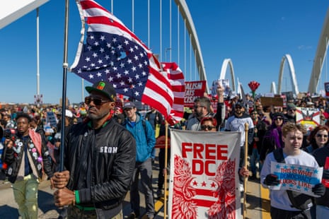 Activists march across the Fredrick Douglas Memorial Bridge on March 28, 2026 in Washington, DC. This is the third nationwide “No Kings” protest held against the Trump administration. (Photo by Tasos Katopodis/Getty Images)
