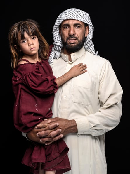 Abbas Gurain Hubaish Alammary, water-buffalo farmer, and his daughter, Fatima. Drought forced them to move from the Sinaf marshes to a nearby settlement