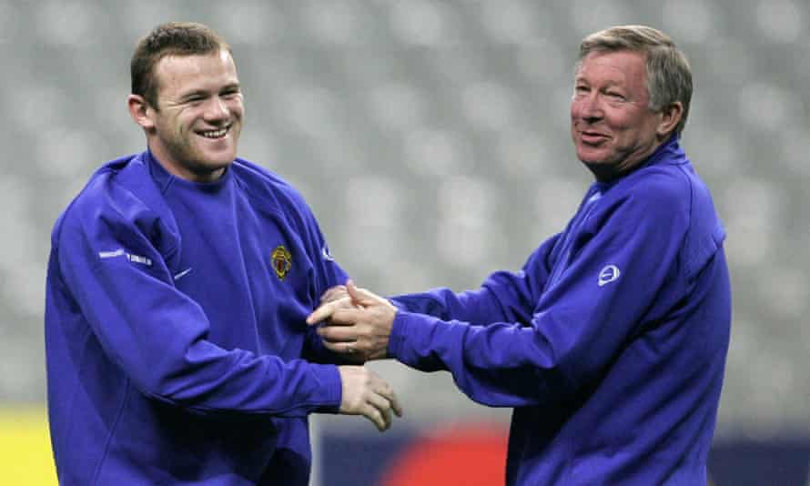 Wayne Rooney and Alex Ferguson share a joke in 2005.