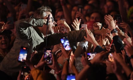 Matt Berninger interacts with the audience at a gig in Portugal in 2022