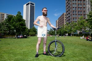 Darrell and his unicycle with a Guardian tote