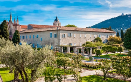 Gardens of monastery and church in sunshine