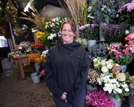 Kate Turnbull surrounded by flowers at Gunns florist