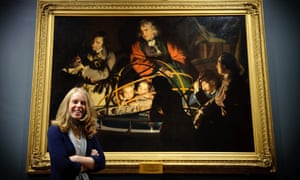 Lucy Bamford in front of Joseph Wright of Derby’s A Philosopher Lecturing on the Orrery