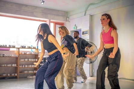 Four young people dancing