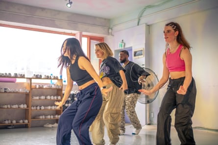 Four young people dancing 