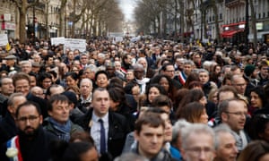 A huge crowd walks during a silent march in Paris, France, in commemoration of 85-year-old Jewish woman Mireille Knoll