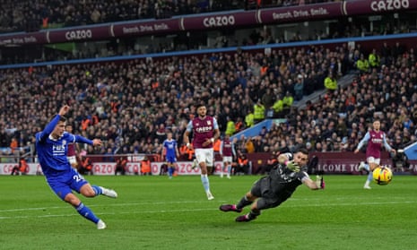 Dennis Praet of Leicester City scores a goal past Aston Villa Goalkeeper Emiliano Martínez.