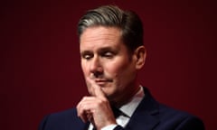 Keir Starmer holding a finger to his mouth