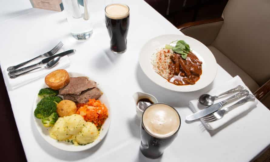 Patrick ate beef stroganoff and rice, €11. Tim ate roast beef and mash, €12. They both drank pint of Guinness, €4.90.