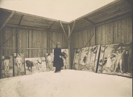Edvard Munch with brush and palette with his canvases at his house outside Oslo.
