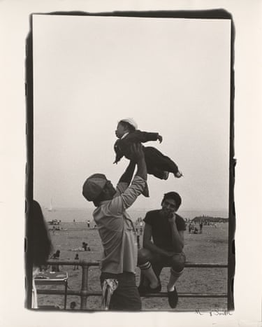 A person holding a child.