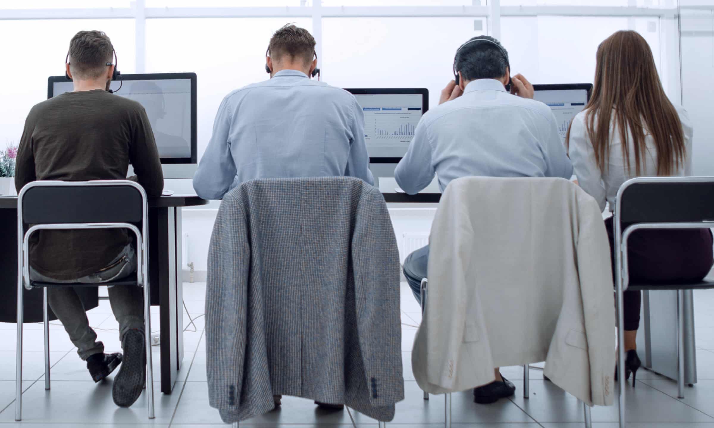 A group of call centre employees sitting at a desk