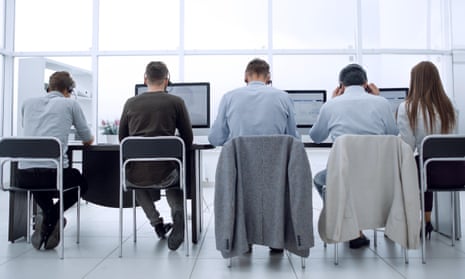 Rear view of employees sitting at desks