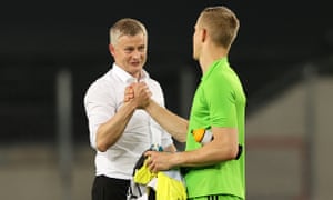 Ole Gunnar Solskjær shakes hands with FC Copenhagen goalkeeper Karl-Johan Johnsson.