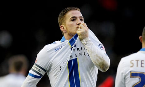 Ross McCormack kisses his Leeds badge after scoring a hat-trick against Huddersfield in February 2014