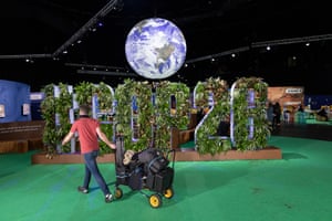 A workman removes equipment in the Hydro venue during Cop26 in Glasgow