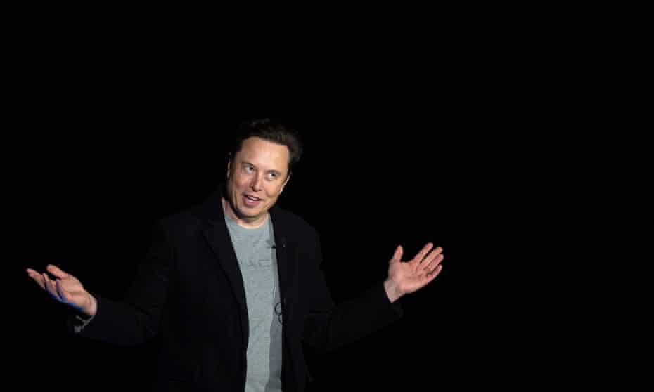 Elon Musk gestures as he speaks during a press conference at SpaceX's Starbase facility in South Texas on February 2022.