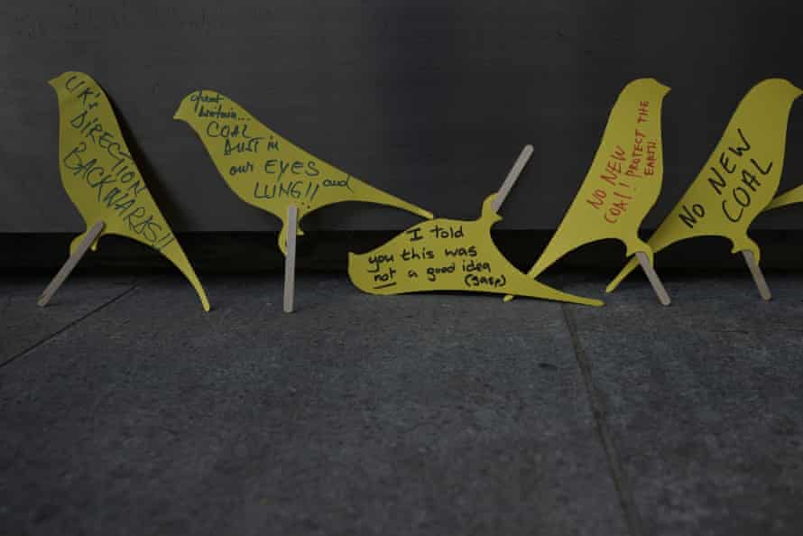 Protesters’ canary-shaped handwritten messages outside the Home Office during a demonstration against a proposed coalmine in Cumbria.